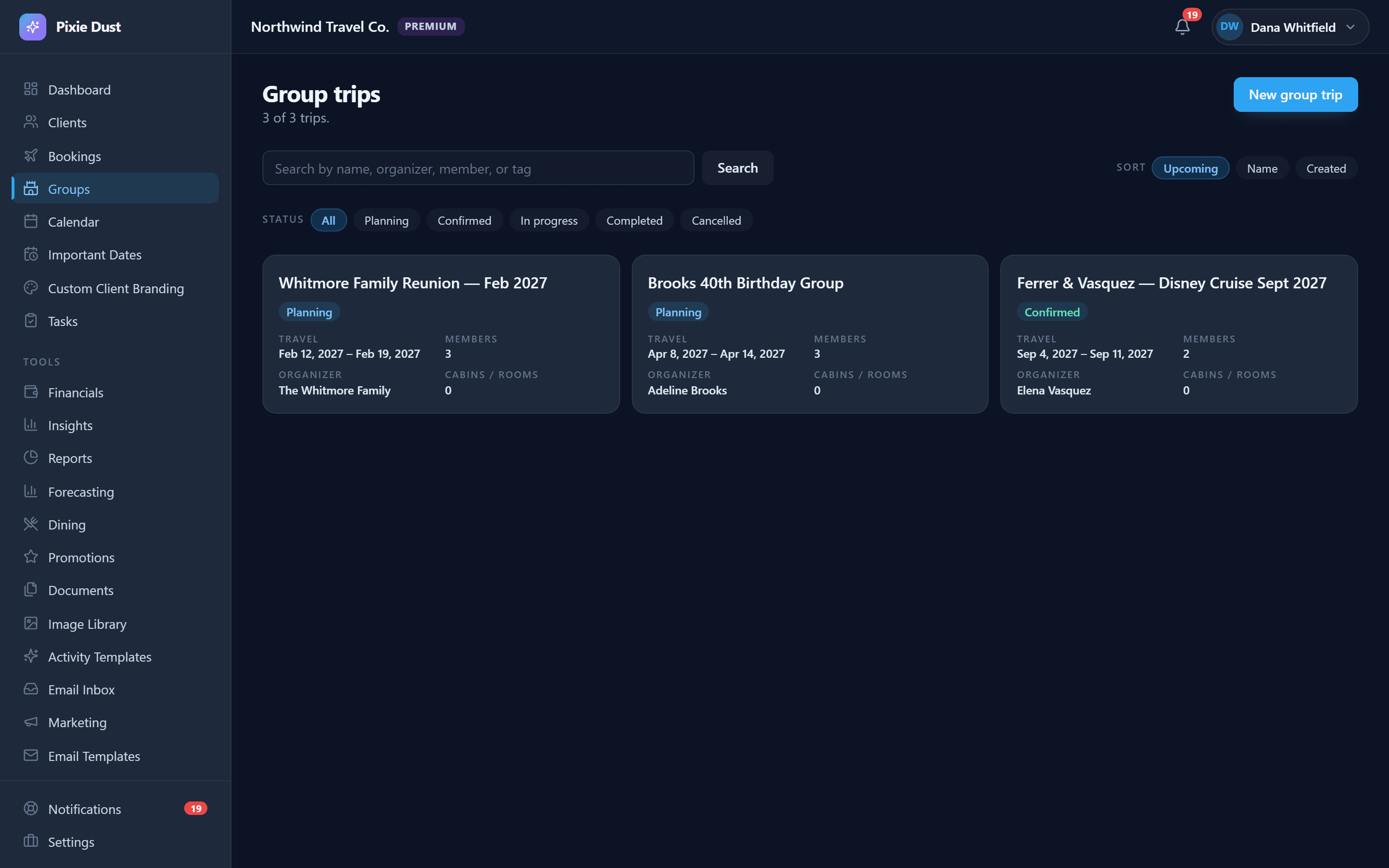 Three group trips — a Whitmore family reunion in February 2027, a Brooks 40th birthday group, and a Ferrer and Vasquez Disney cruise — each showing status, travel dates, member count and organizer